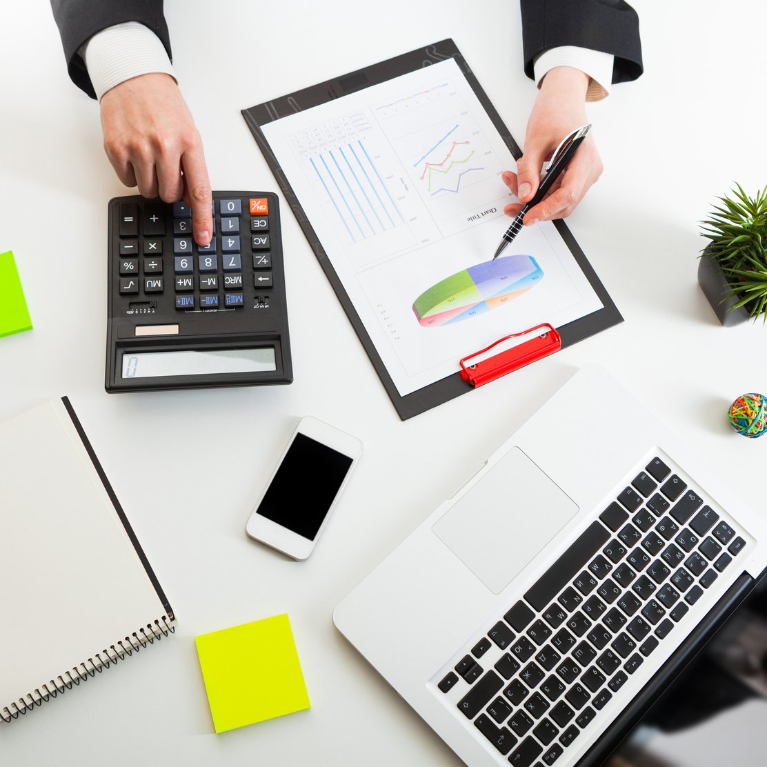 Close up view of bookkeeper or financial inspector hands making report, calculating or checking balance.